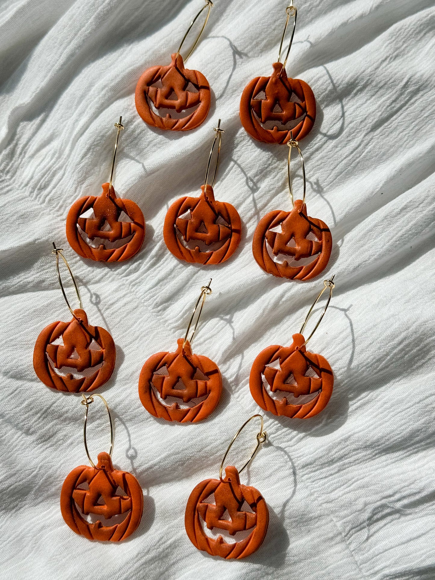 Rotten carved pumpkin dangles