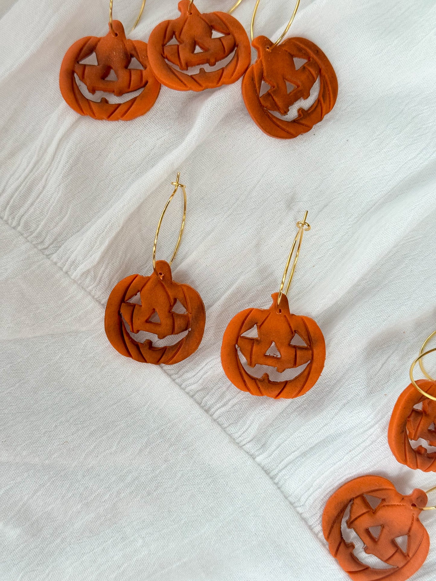 Rotten carved pumpkin dangles
