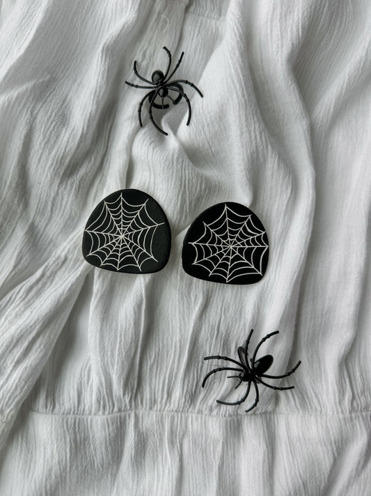 Carved spider web studs